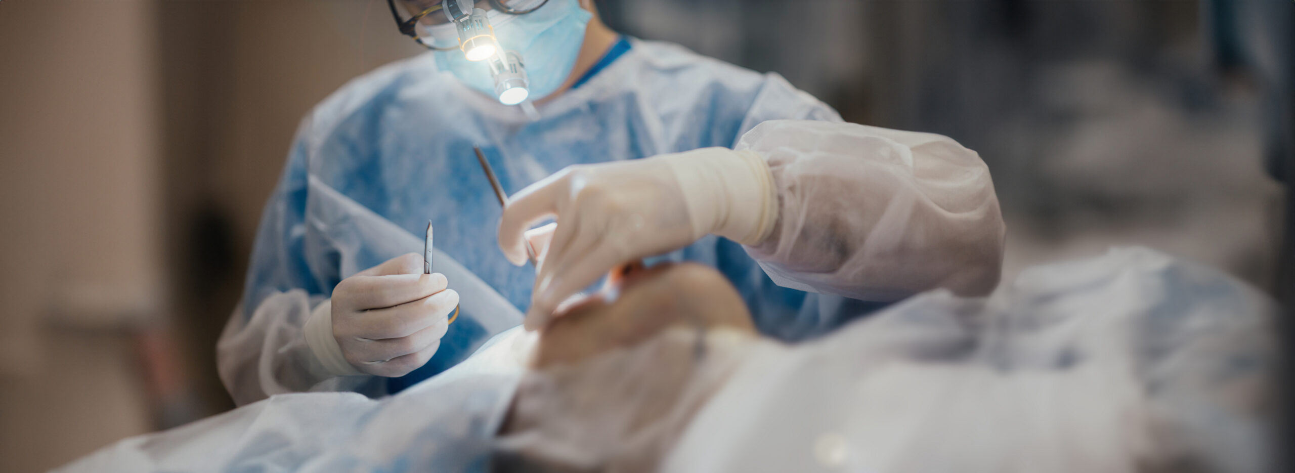 plastic surgery, facial correction in the clinic. Teamwork